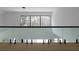 Upstairs landing featuring glass railing with view of the forest at 4031 Oak Forest Cir, Marietta, GA 30062