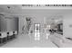 Bright, open-concept living space with a modern staircase, sleek white floors, and a stylish wine storage area at 4031 Oak Forest Cir, Marietta, GA 30062