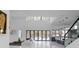 Open-concept living room with a view of the backyard pool and modern décor at 4031 Oak Forest Cir, Marietta, GA 30062