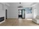 Bright living room featuring hardwood floors, modern fireplace, and glass doors to the outside at 4031 Oak Forest Cir, Marietta, GA 30062