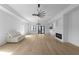 Open living room with hardwood floors, fireplace, and modern lighting at 4031 Oak Forest Cir, Marietta, GA 30062