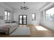 Bright main bedroom featuring a tray ceiling, wood floors and multiple windows at 4031 Oak Forest Cir, Marietta, GA 30062