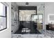 Bathroom with a large glass shower, dark tile accent wall, and marble tile flooring at 4031 Oak Forest Cir, Marietta, GA 30062
