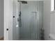 Modern shower featuring textured tile, sleek black fixtures and a niche for bath products at 4031 Oak Forest Cir, Marietta, GA 30062