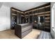 Well-organized walk-in closet with custom shelving, drawers, and ample space for storage at 4031 Oak Forest Cir, Marietta, GA 30062