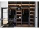 Spacious walk-in closet with custom shelving, hanging space, and glass display for accessories at 4031 Oak Forest Cir, Marietta, GA 30062