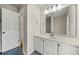 Bright bathroom features a large mirror, vanity with storage, and modern fixtures at 1160 Chateau Ter, Mcdonough, GA 30253