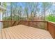 Spacious deck with wooden railing perfect for entertaining or relaxing at 1160 Chateau Ter, Mcdonough, GA 30253