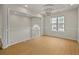 Bright dining room with hardwood floors, modern lighting, and wainscoting at 1160 Chateau Ter, Mcdonough, GA 30253