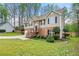 Charming two-story home with mature trees surrounding the landscaped yard at 1160 Chateau Ter, Mcdonough, GA 30253