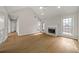 Bright and spacious living room with wood flooring, fireplace, and outdoor access at 1160 Chateau Ter, Mcdonough, GA 30253