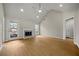 Spacious living room features vaulted ceilings, fireplace and wood flooring at 1160 Chateau Ter, Mcdonough, GA 30253