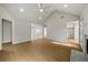 Spacious living room featuring wood floors, recessed lighting, and access to other rooms at 1160 Chateau Ter, Mcdonough, GA 30253