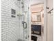 Modern bathroom showcases a tiled shower, a blue vanity, patterned flooring, and stylish fixtures at 91 Ne Rumson Ne Rd # B20, Atlanta, GA 30305