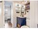 Stylish bathroom featuring a blue vanity, white subway tile, decorative shelving, and a patterned floor at 91 Ne Rumson Ne Rd # B20, Atlanta, GA 30305