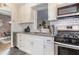 Well-lit kitchen showcases sleek countertops, modern appliances, white subway tile backsplash, and ample cabinet space at 91 Ne Rumson Ne Rd # B20, Atlanta, GA 30305