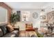 Cozy living room with brick wall, leather sofa, and modern decor at 91 Ne Rumson Ne Rd # B20, Atlanta, GA 30305