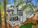 Aerial view of a home's backyard with a spacious deck and artificial turf putting green at 2015 Chelton Se Way, Smyrna, GA 30080