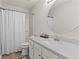 Clean, well-lit bathroom with modern fixtures, white cabinets, and elegant mirror at 2015 Chelton Se Way, Smyrna, GA 30080