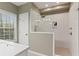 Bathroom featuring glass-enclosed shower, modern fixtures, and neutral tones at 2015 Chelton Se Way, Smyrna, GA 30080