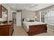 Well-lit bedroom features a cozy bed, dresser, and sun-filled window at 2015 Chelton Se Way, Smyrna, GA 30080