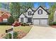 Attractive two-story home featuring a well-maintained lawn and a two-car garage at 2015 Chelton Se Way, Smyrna, GA 30080