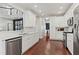 Modern kitchen with white cabinets, stainless steel appliances, and sleek countertops at 2015 Chelton Se Way, Smyrna, GA 30080
