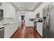 Spacious kitchen with white cabinets, stainless steel appliances, and hardwood floors at 2015 Chelton Se Way, Smyrna, GA 30080