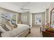 Bright main bedroom with lots of natural light, complemented by a ceiling fan at 2015 Chelton Se Way, Smyrna, GA 30080