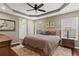 Relaxing main bedroom with tray ceiling, large bed, and stylish decor at 2015 Chelton Se Way, Smyrna, GA 30080