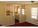 Bright living room with classic trim and large windows showcasing an eat-in kitchen at 130 Scarlet Dr, Jonesboro, GA 30236