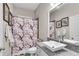 Bathroom featuring a modern vanity, granite countertop, vessel sink, and decorative shower curtain at 244 Cedar Ridge Way, Dallas, GA 30157