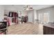 Large walk-in closet with custom shelving, hardwood floors, ceiling fan and ample storage space at 244 Cedar Ridge Way, Dallas, GA 30157