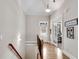 Inviting staircase with hardwood floors and a view of the foyer, leading to upper floors with elegant design elements at 244 Cedar Ridge Way, Dallas, GA 30157