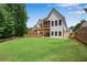 Spacious home featuring a large yard, multi-level deck, stone accents, and desirable architectural details at 244 Cedar Ridge Way, Dallas, GA 30157