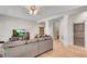 Open-concept living room with hardwood floors, neutral paint, and decorative pillars at 244 Cedar Ridge Way, Dallas, GA 30157