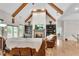 Bright living room with wooden beams, fireplace, and built-in bookshelves at 244 Cedar Ridge Way, Dallas, GA 30157
