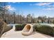 Community pool features a water slide with mature landscaping in a wooded surrounding at 244 Cedar Ridge Way, Dallas, GA 30157