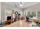 Spacious room with hardwood floors, natural light, ceiling fan, and versatile layout at 244 Cedar Ridge Way, Dallas, GA 30157
