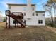 Spacious backyard features a wooden deck with steps down to a grass-covered yard, ideal for entertaining at 3110 Cambrian Ter, Austell, GA 30106