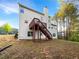 Expansive backyard includes a wooden deck with steps down to a lush lawn, perfect for outdoor activities and relaxation at 3110 Cambrian Ter, Austell, GA 30106