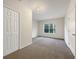 Comfortable carpeted bedroom with natural light from the window at 3110 Cambrian Ter, Austell, GA 30106