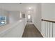 Bright hallway with neutral carpet and paint leads to various rooms in the home at 3110 Cambrian Ter, Austell, GA 30106