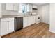 Practical kitchenette with white cabinetry, and a modern stainless steel dishwasher at 3110 Cambrian Ter, Austell, GA 30106