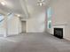 Spacious living room with a high ceiling, fireplace, carpet and natural light at 3110 Cambrian Ter, Austell, GA 30106