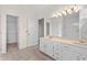 Bright bathroom features a dual sink vanity, large mirror and spacious tiled walk-in shower at 1550 Pine Creek Way, Woodstock, GA 30188