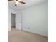 Bedroom with neutral walls, plush carpet, and a doorway to an adjoining room at 1550 Pine Creek Way, Woodstock, GA 30188
