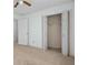 Bright bedroom with a folding closet door, neutral carpet, and access to an adjoining room at 1550 Pine Creek Way, Woodstock, GA 30188