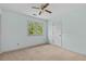 A serene bedroom with ample natural light and a ceiling fan at 1550 Pine Creek Way, Woodstock, GA 30188