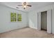 Inviting bedroom featuring ample natural light and a ceiling fan for added comfort at 1550 Pine Creek Way, Woodstock, GA 30188